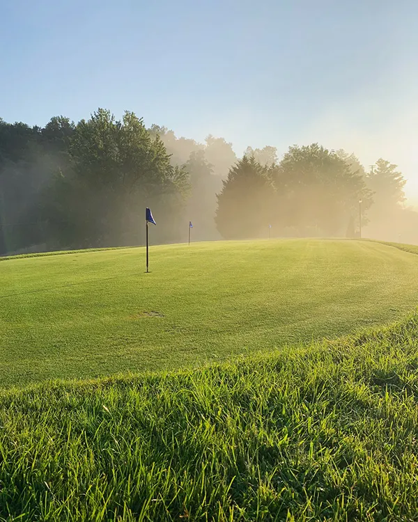 Laurel Valley Country Club Townsend, TN - Pristine putting green with strategic bunkers and mature landscaping, Resort 18-hole Tennessee golf course