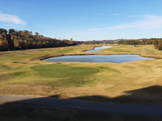 Sevierville Golf Club Sevierville, TN - Pristine putting green with strategic bunkers and mature landscaping, Public 36-hole Tennessee golf course