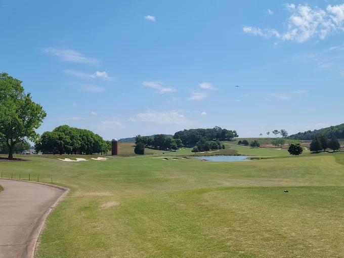 Tennessee National Golf Club Loudon TN - Panoramic fairway view hole 12 with strategic bunkers and mature trees