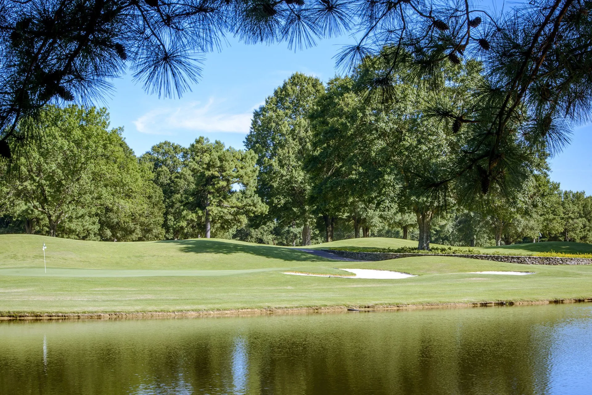 Windyke Country Club Memphis, TN - Pristine putting green with strategic bunkers and mature landscaping, Private 36-hole Tennessee golf course